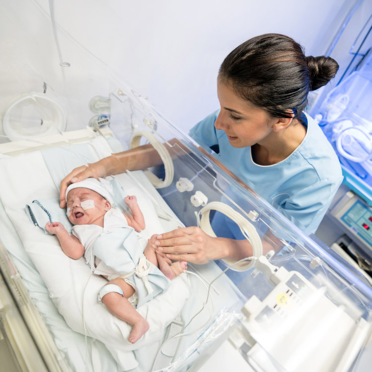 A mother with her baby in the NICU